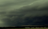  - Looking Southwest over the airfield at a nasty summer storm - by Florida Metal
