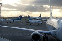  - A busy morning in Auckland: Air NZ's DHC 8-300 (ZK-NEN), Saab 340 (ZK-NLG), B 737-300 (ZM-NGM), and in the background B 767-300 (ZK-NCJ) is taxiing to the runway - by Micha Lueck