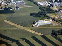  - Passing at 2000 flying east; looking northward.  Just a patch of grass used mainly by the new sport aircraft and ultrlights - by Herb Harris