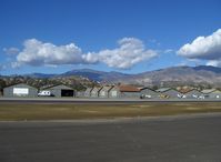  - Old Hangars, Topa Topa Mountains, Santa Paula Ridge, Santa Paula Peak in background. Elevations:  Topa Topa Mts. 6,244 ft & 6,704 ft. Ridge 2,817 ft. Peak 4,917 ft. - by Doug Robertson