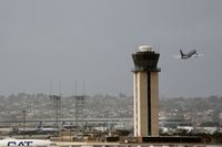  - United plane passes tower - by Chuck Martinez