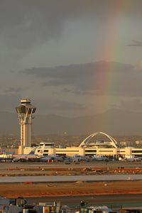  - Rainbow at LAX on a stormy afternoon in February. - by Dean Heald