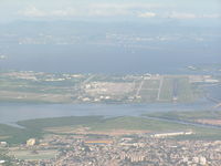  - Looking down runway 15. Main Terminal on left. Aircraft in takeoff position on runway 10 far left side of photo - by John J. Boling