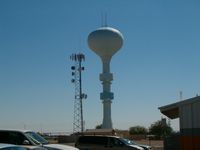  - The water tower at the edge of the field. - by IndyPilot63