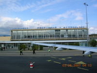  @ Perpignan Rivesaltes Airport - Terminal at Perpignan, France. No jet bridge. Stairs and walk across the ramp - rain or shine - by John J. Boling