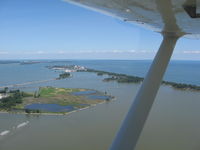  @ Griffing Sandusky Airport - In the pattern on downwind for runway 9, looking north at Cedar Point amusement park. - by Bob Simmermon
