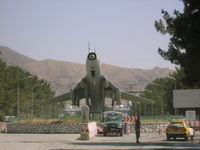  @ Kabul International Airport - MIG on display outside terminal at Kabul, Afghanistan - by John J. Boling