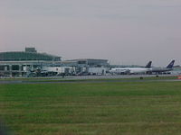 - The unusual sight of a an Air Luxor A320 next to a United 757 at the terminal in Providence - by Geoff Cook