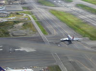  - Boeing B747 cargo jet on taxiway. Taken from DHC-2 Beaver float plane N4444Z enroute to adjacent Lake Hood Sea Plane Base LHD. Blur across photo is copilot's window down edge. - by Doug Robertson