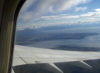  - Airport adjacent Cook Inlet, Point Woronzof of Knik Arm. Taken from Alaska Airlines B737-700 climbing turn to altitude - by Doug Robertson