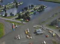  - Float planes at Lake Hood SPB, taken from DHC-2 Beaver floatplane N4444Z enroute to LHD for landing. Diagonal blur is copilot's down window edge. - by Doug Robertson