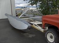  - Highly modified truck with capability to position straight-float plane aircraft out of water. Closeup of carrier body with float set only. - by Doug Robertson