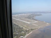  - Entering right downwind, RWY 14.  Mobile Bay at right. - by D. Luke