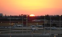  @ Fort Lauderdale/hollywood International Airport - The sunsets over the busy FBO during Miami Boat Show Week - by Terry Fletcher
