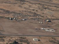  - Winding down ... The concrete slab is where the T&G (Air Response) hangar used to be. Some PV2s and a compound full  of H-19s still in evidence. - by John Meneely