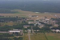  - Left downwind for Rwy 9 over downtown Gladwin - by Tom Hermann