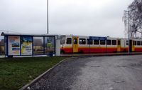  - The Rail link to the centre of Krakow is marketed as the 'Balice Express'  - a little grand for a 2-car railcar leaving from a platform with a Bus Shelter ! - but the half hourly service does get you into the centre of Krakow in 16 minutes for 6 PZL - by Terry Fletcher
