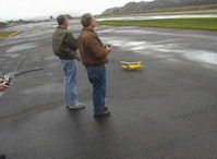  - RC Drone flights on a calm windless day near threshold to Rwy 04, Monoplane & Ornithopter flight controllers. Tiger Moth RC drone on deck. - by Doug Robertson