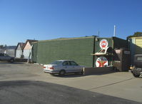  - The ex-Steve McQueen home/hangar for his Stearman bipe. Was home also prior to his purchase of nearby 15 acre ranch & home. Still painted the same. - by Doug Robertson
