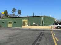  - The ex-Steve McQueen home/hangar for his Stearman bipe. Was home also prior to his purchase of nearby 15 acre ranch & home. Still painted the same. - by Doug Robertson