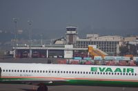  - The airport firefighter building can be seen behind the MD-90 from EVA Air - by Michel Teiten ( www.mablehome.com )