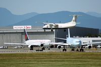  - DHC-8 landing while one 767 and one A340 are waiting for take-off - by Michel Teiten ( www.mablehome.com )