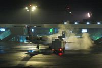  - Embraer from Luxair being deiced for an early morning winter flight - by Michel Teiten ( www.mablehome.com )