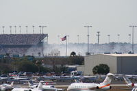  - Smoke from a crash on the track during Busch Race in background - by Florida Metal