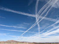  @ Harry Reid International Airport - Contrails over McCarran - by Brad Campbell