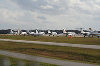  - Line up of jets parked on Runway 16/34 during Daytona 500 - by Florida Metal