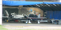  @ Lashenden/Headcorn Airport - Hangar Area at Lashenden/Headcorn UK (G-BCID - left & G-KENW - right) - by Jeff Sexton