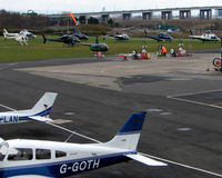  - Despite the waterlogged airfield being closed to fixed wing traffic , 8 Helicopter vistors to Barton Airfield for the Manchester United v Arsenal Soccer match - by Terry Fletcher