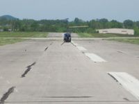  - Helicopter landing on runway 32. - by Bob Simmermon
