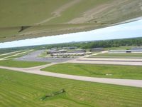  @ Clark Regional Airport - Departing 32 and looking south at downtown Louisville on the horizon. - by Bob Simmermon