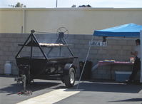  - Preparing big barbeque near N124YK host hangar for group fly-In lunch. - by Doug Robertson