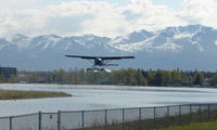  - A DHC2 Beaver takes off from Spenard Lake end against a beautiful backdrop - by Terry Fletcher