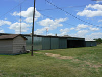  @ Flying L Airpark Airport - Flying L Private Strip - Unsure weather this airfield is still open. There is a fence and new subdivision of houses built with in yards of the hanger building, there was no airplane in the hanger and I could not see the runway - by Zane Adams