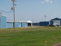  - SEVERAL HANGERS AT AURORA'S AIRPORT - by Gary Schenaman