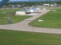  @ Fond Du Lac County Airport - Corporate hangers, departing 36. - by Bob Simmermon