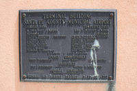  - Santa Fe Municipal  - marker on terminal building - by Zane Adams