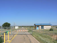  - Santa Rosa, New Mexico - new security fences and gate for an airport with no hangers, virtually no traffic and the only airplane on the airport is an ex-Air Force A-7 gate guard...More government time and money wasted...all to keep us safe  - by Zane Adams