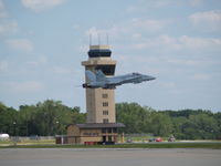  - F-18 HORNET IN FORGROUND OF OFFUTT CONTROLL TOWER - by Gary Schenaman