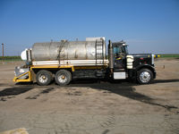  - Tri-Star Agrinautics (cropdusters) mother truck at Wasco-Kern County Airport, CA - by Steve Nation