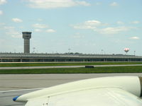  - Several towers on this airport-this is NOT the Air Traffic Control Tower. From N2111Q Beech BONANZA 36 taxiing in - by Doug Robertson