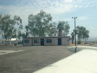  - Terminal Bldg. Phone to Riverside FSS, toilets and flight-planning tables - by Doug Robertson