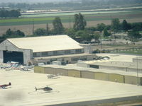  - FBO hangar shared by Ventura County Sheriff Helicopter unit at west end, looking southwest from BONANZA N2111Q - by Doug Robertson