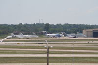  @ Detroit Metropolitan Wayne County Airport - Looking across Runways 3R/21L and 3L/21R at an ex Spirit MD80, Detroit Pistons DC-9 and several private jets - by Florida Metal