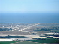  - Naval Air Warfare Station, Point Mugu, California. Pacific Ocean beyond. Lower right portion shows Channel Islands Air National Guard taxiway and ramp who shares Point Mugu's two runways. Taken from RV-6, N406L. - by Doug Robertson