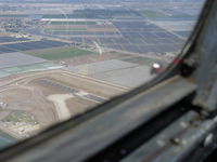  - Displaced threshold chevron markings to 6,013' Rwy 26. Taken from north of airport from Beech 36 BONANZA - by Doug Robertson