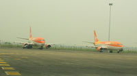  - Adam Air aircraft awaiting re-po at Jakarta. - by John J. Boling